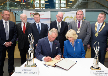 The Prince of Wales and The Duchess of Cornwall signing the Donegal Visitor Book at a reception in the Letterkenny Institute of Technology, Back from left are Paul Hannigan, President, LYIT, Fintan Moloney, Chairman LYIT, Seamus Neely, Donegal County Council CEO, The Minister for Foreign Affairs and Trade, Charles Flanagan T.D., 