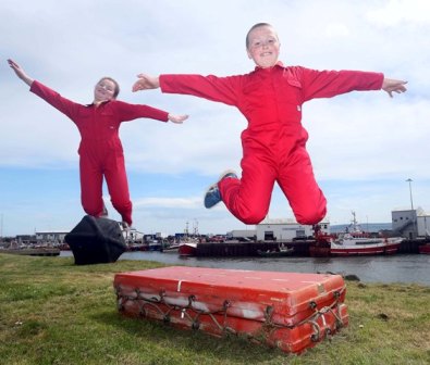 Fiona McLaughlin and John Lynch from Scoil Cholmcille, Greencastle jumping with joy at announcement that the Red Arrows are set to perform to celebrate the official Race Start of the Clipper 2013-14 Race at Greencastle, Co. Donegal on Sunday 29 June 2014.  A show not to be missed.