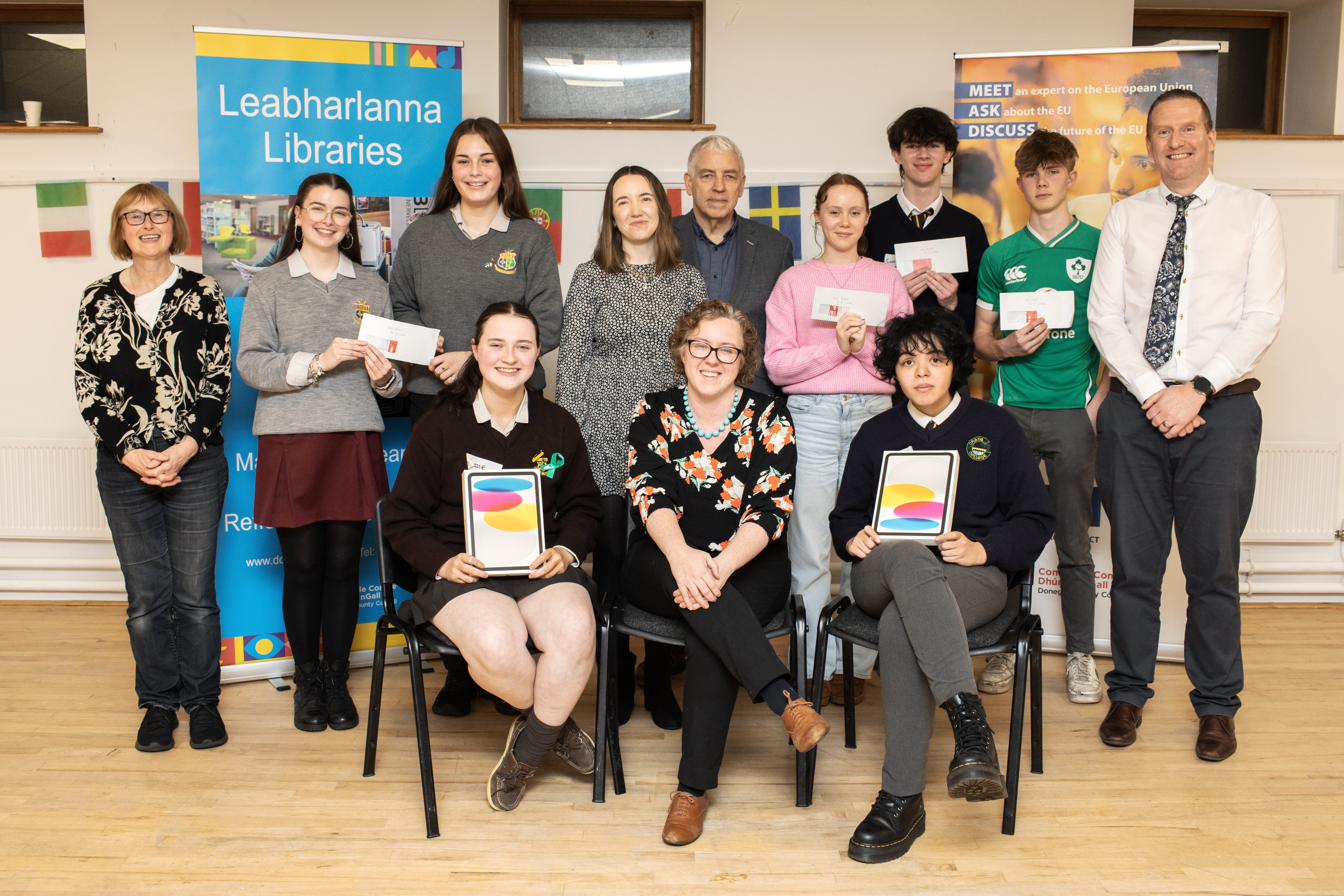 Back row - Una Matthewson, Central Library; Riley Doherty and Sarah McHugh; Dr Aoife Hill, ATU Letterkenny; Mícheál Ó hÉanaigh (Vice President for Youth, Culture & Tourism in the Assembly of European Regions), Annabel Breslin; Conor McShane; Olan Doogan-Bellec; and Kevin McCaul (Manager of Europe Direct Letterkenny). Sitting – Cassie Lambe (1st place 16 and under) Dr Gillian Kennedy (Policy & Research Manager European Movement Ireland) and Nicolas Govka (1st place in the 17 and over category)