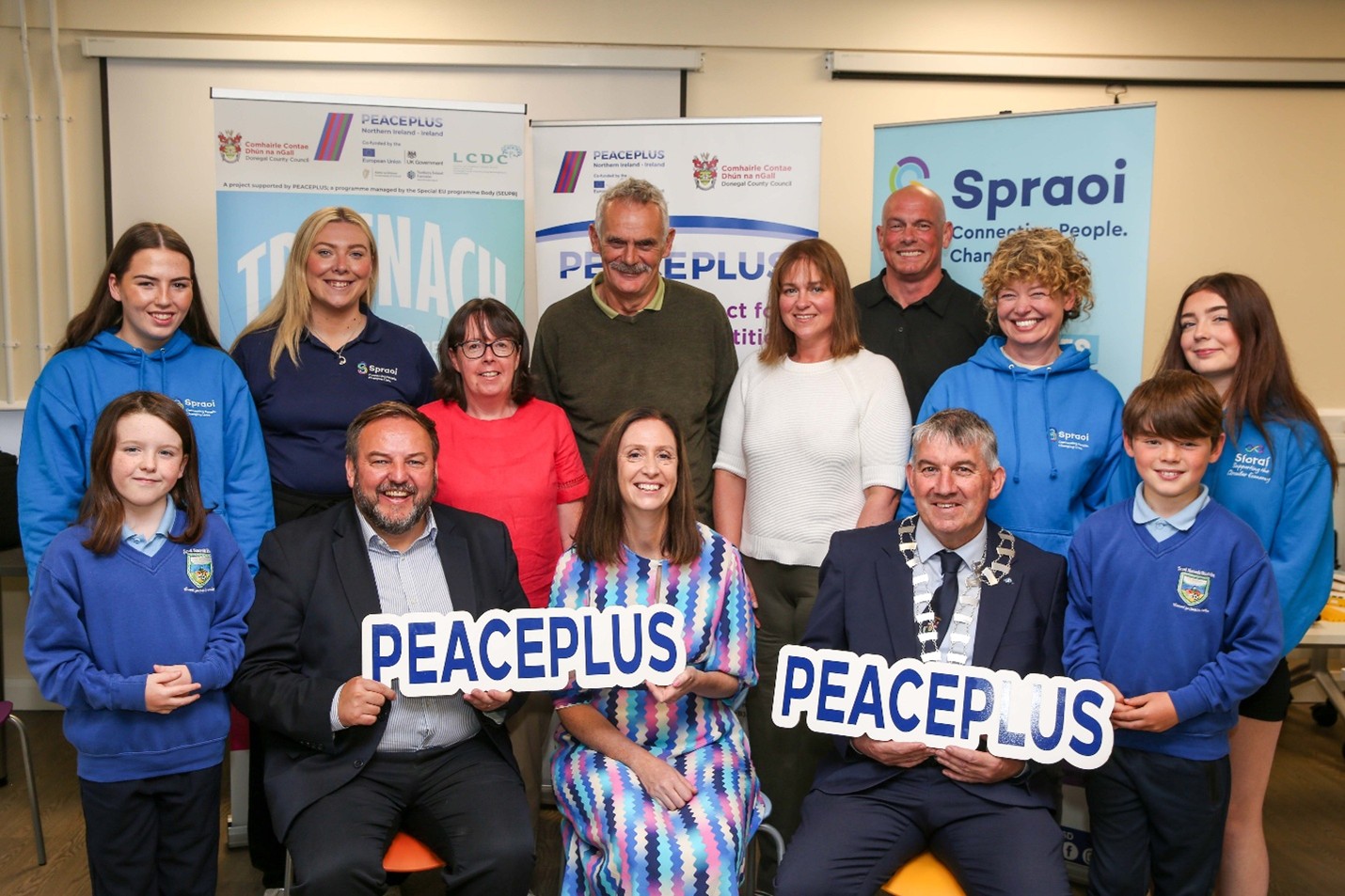 Back L-R Rosa McLaughlin, Aine Kelly (Spraoi agus Spórt), Marie Mulhern (Donegal County Council), Andrew Ward (Joint CEO IDP), Pauline Smyth (PEACEPLUS Co-ordinator, Donegal County Council), John Peto (Spraoi agus Spórt), Carlene Lyttle (Spraoi agus Spórt), Chloe Doherty, Front Row L-R Logan McDaid, Deputy Padraig Mac Lochlainn TD, Helen Nolan (Co-Founder and CEO, Spraoi agus Spórt), Cllr. Paul Canning Cathaoirleach Donegal County Council, Aidan Assal