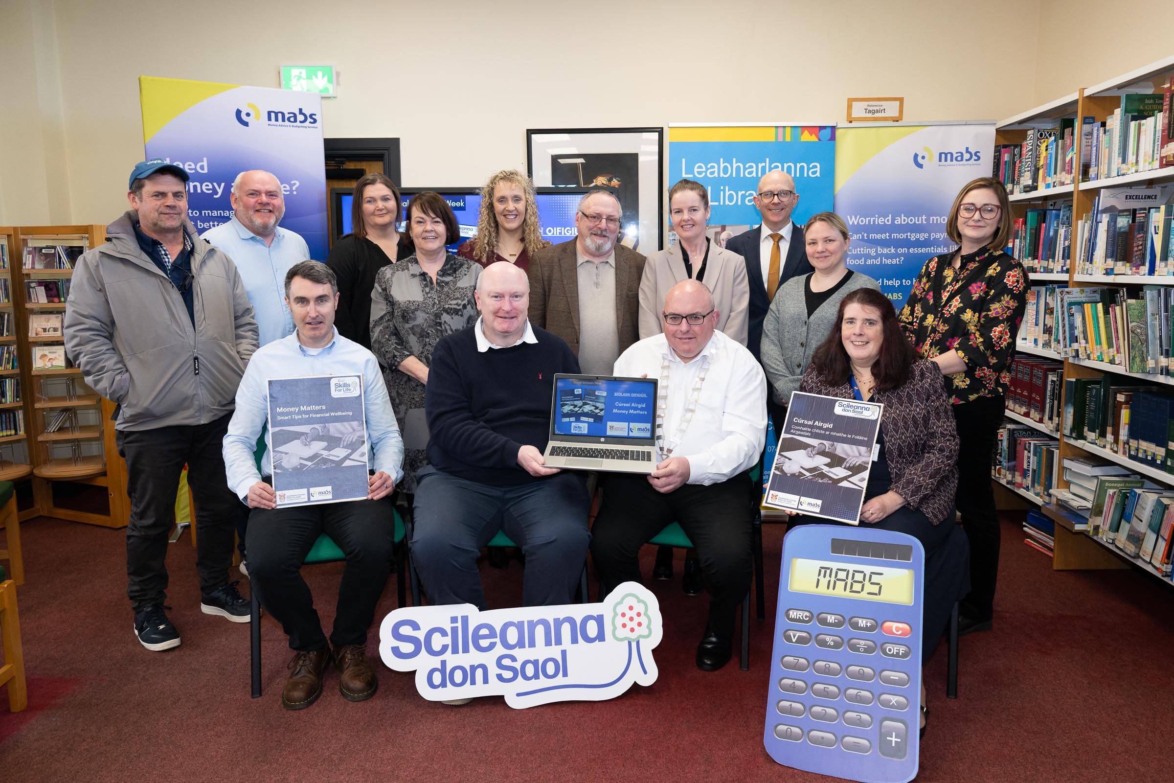 Money Matters Financial Literacy Digital Resource Launched at Leabharlann Phobail na Rosann pictured at the launch are seated Joseph Kelly, Donegal Library,  Denis McGeady, Donegal Library, Cllr Michael McClafferty (MD Cathaoirleach) and Noreen Doogan, MABS, Derrybeg. Back from left Cllr Denis McGee, John Curran, Bridin Sharkey, Madgie Gildea, Martina Ní Chanainn, Cllr John Shéamais Ó Fearraigh, Marie Coll, Karl Cronin, Kayley O'Donnell, and Karen Sheehy, Donegal Library Photo Clive Wasson